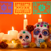 colorful day of the dead decorated skulls and candles