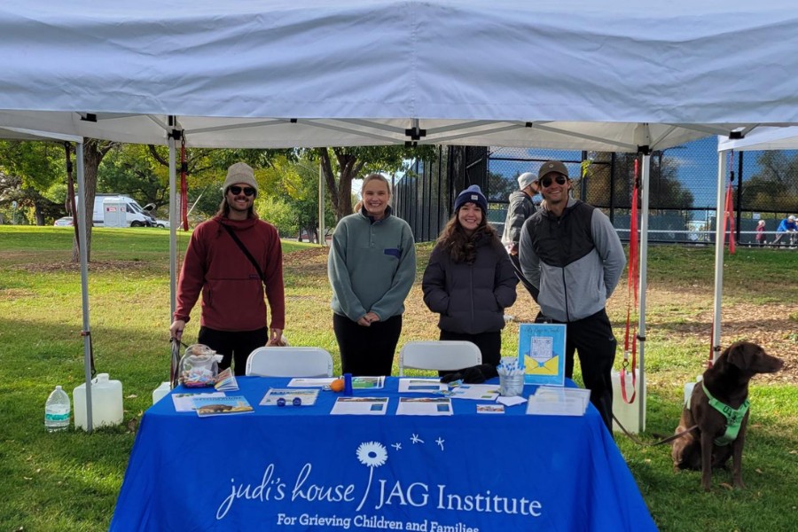 Judi's House Ambassador volunteers from the Emerging Leaders Network pose for a photo while volunteering at the Out of the Darkness walk for suicide awareness.
