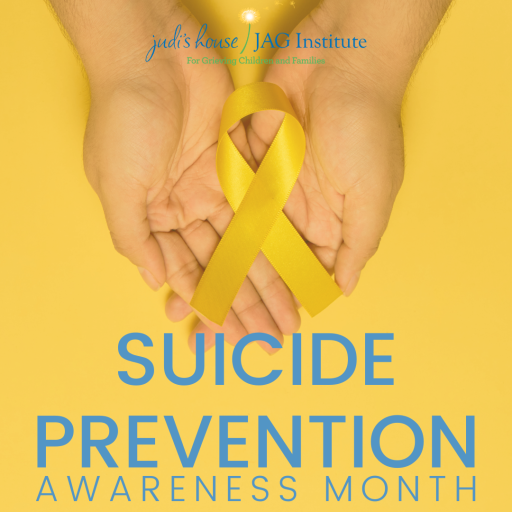 Suicide Prevention Awareness month hands holding a yellow ribbon on a yellow background