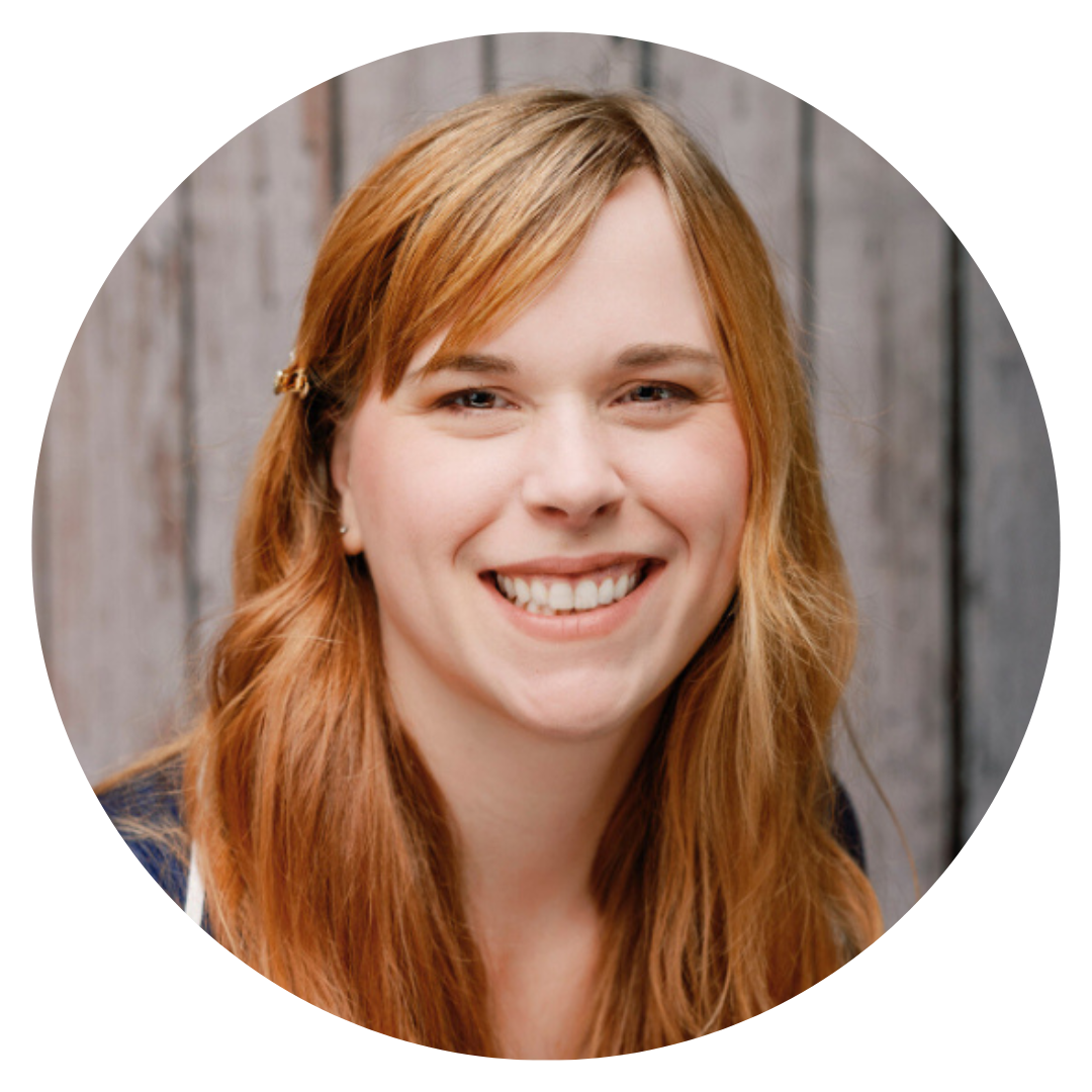 Female Judi's House Marketing & Communications specialist with strawberry blonde hair smiling